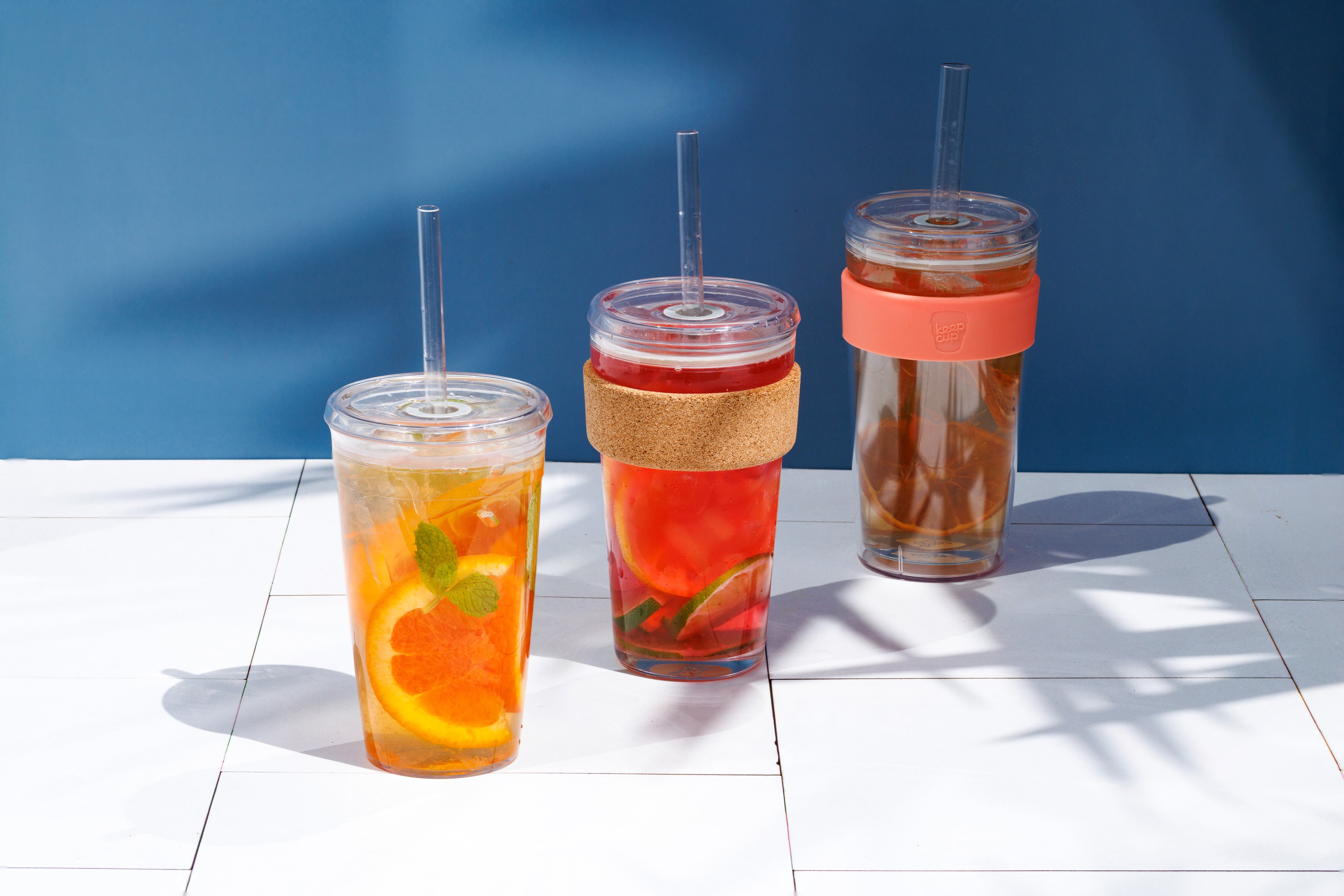 Cold Cup Original, Cork and Longplay filled with summer beverages in warm bright light