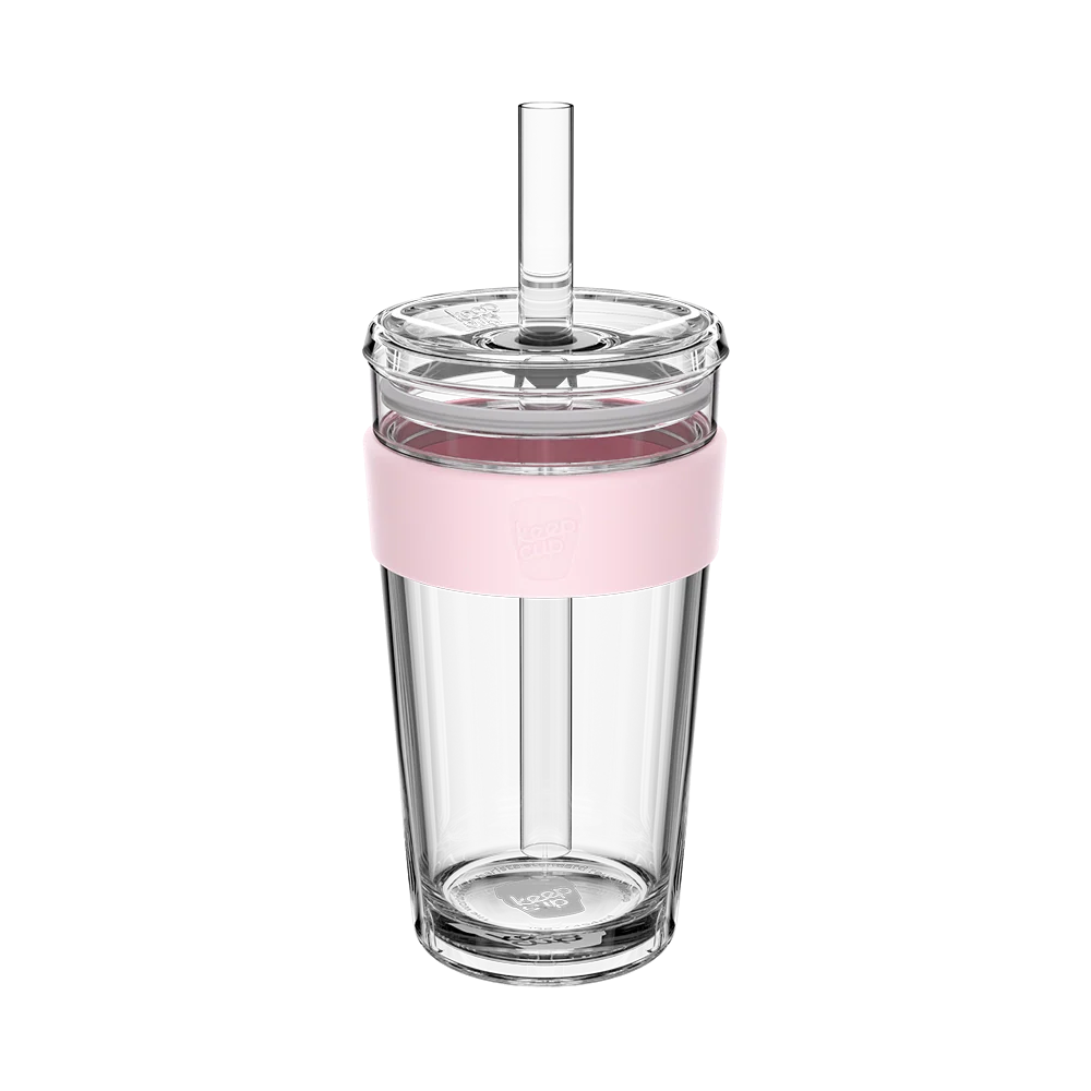 Large Glass tumbler with a pink rim and straw on a white background