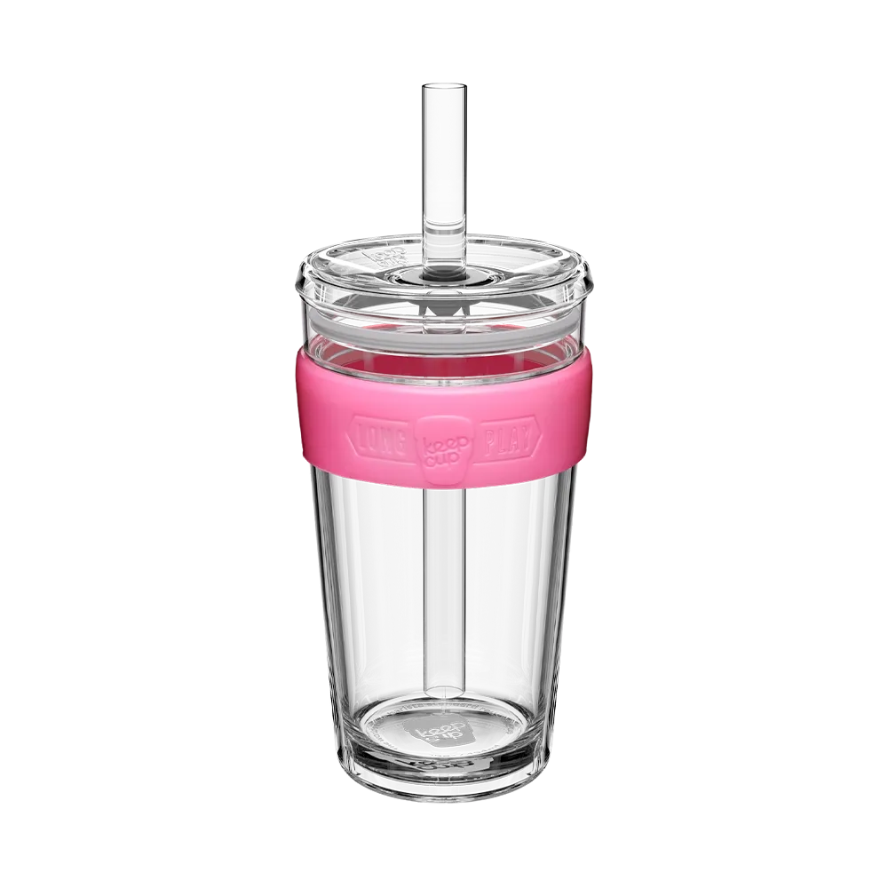 Clear tumbler with a pink lid and straw on a white background