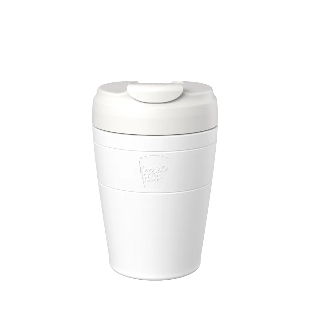 White reusable coffee cup with a lid on a white background