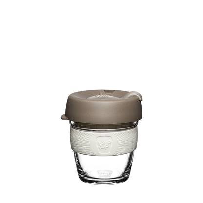 KeepCup reusable glass XS cup with light brown lid and white band on white background