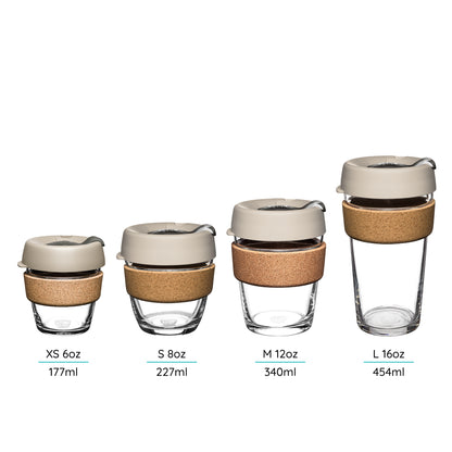 Set of four reusable glass 
cups with cork bands - different sizes shown on a white background