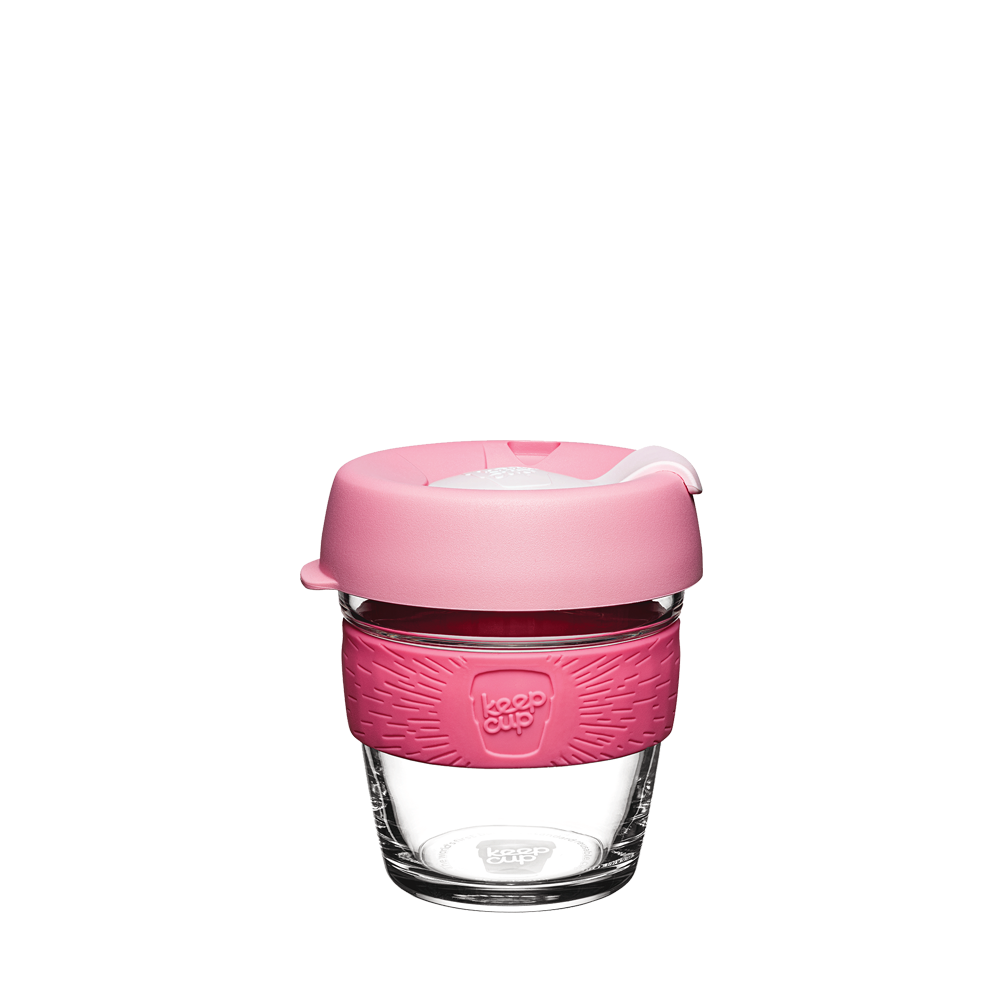 KeepCup Brew XS 6oz in Saskatoon, featuring a clear glass cup with a pink silicone band and matching pink lid with a white plug, shown against a plain white background.
