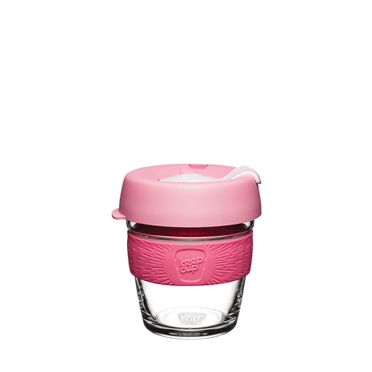KeepCup Brew XS 6oz in Saskatoon, featuring a clear glass cup with a pink silicone band and matching pink lid with a white plug, shown against a plain white background.