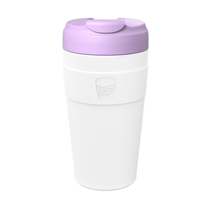 KeepCup Commuter L 16oz in White Lilac, featuring a white reusable cup body with embossed logo on the silicone band and a lavender-coloured lid with flip-top closure, shown against a plain white background.