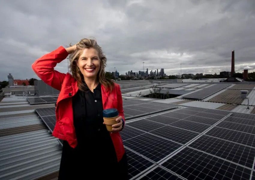 KeepCup low impact Solar Powered Office and Warehouse in Australia and UK Abigail Forsyth KeepCup Co-founder on Australian HQ rooftop with 76KW of solar panels on rooftop