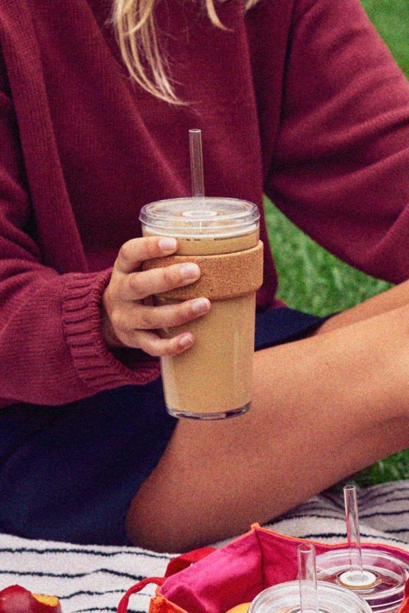 Woman holding KeepCup Cold Cup Cork in 16oz