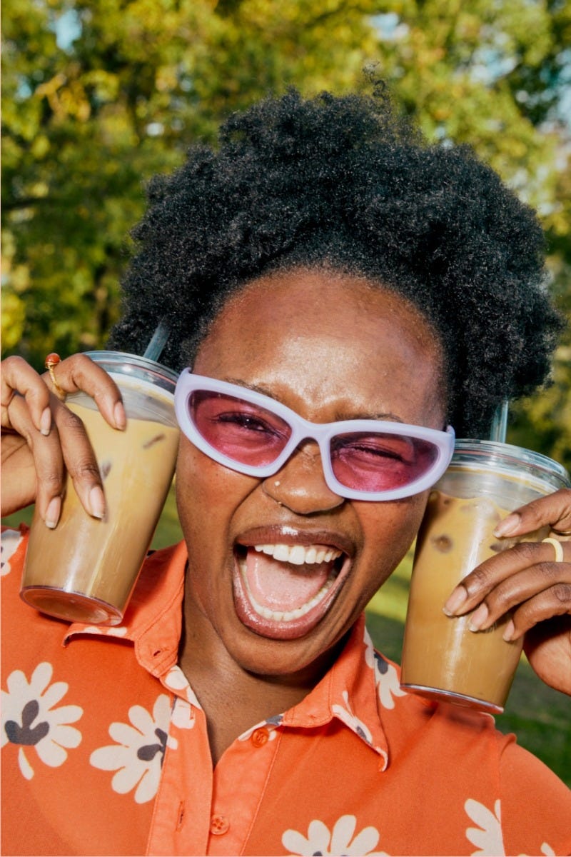 Woman holding KeepCup Cold Cup Original with coffee straw